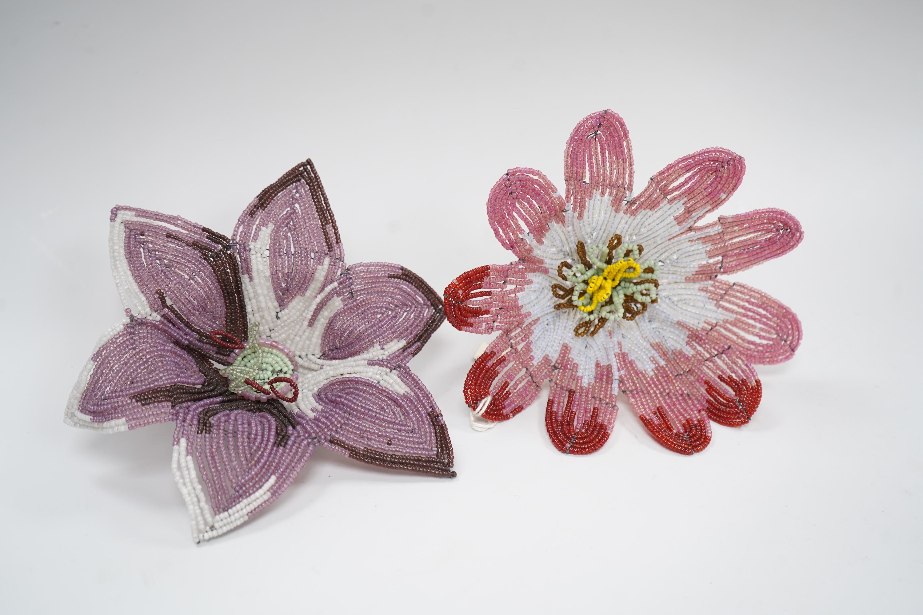 A group of beadwork floral appliqués, necklaces and an evening bag